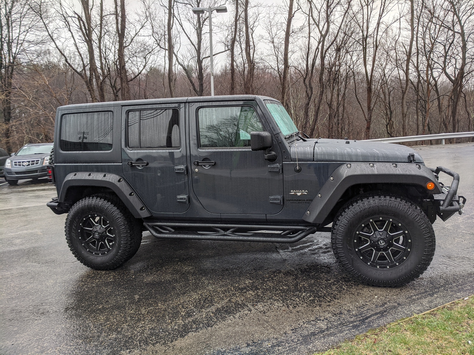 Pre-Owned 2016 Jeep Wrangler Unlimited Sahara in Rhino Clearcoat