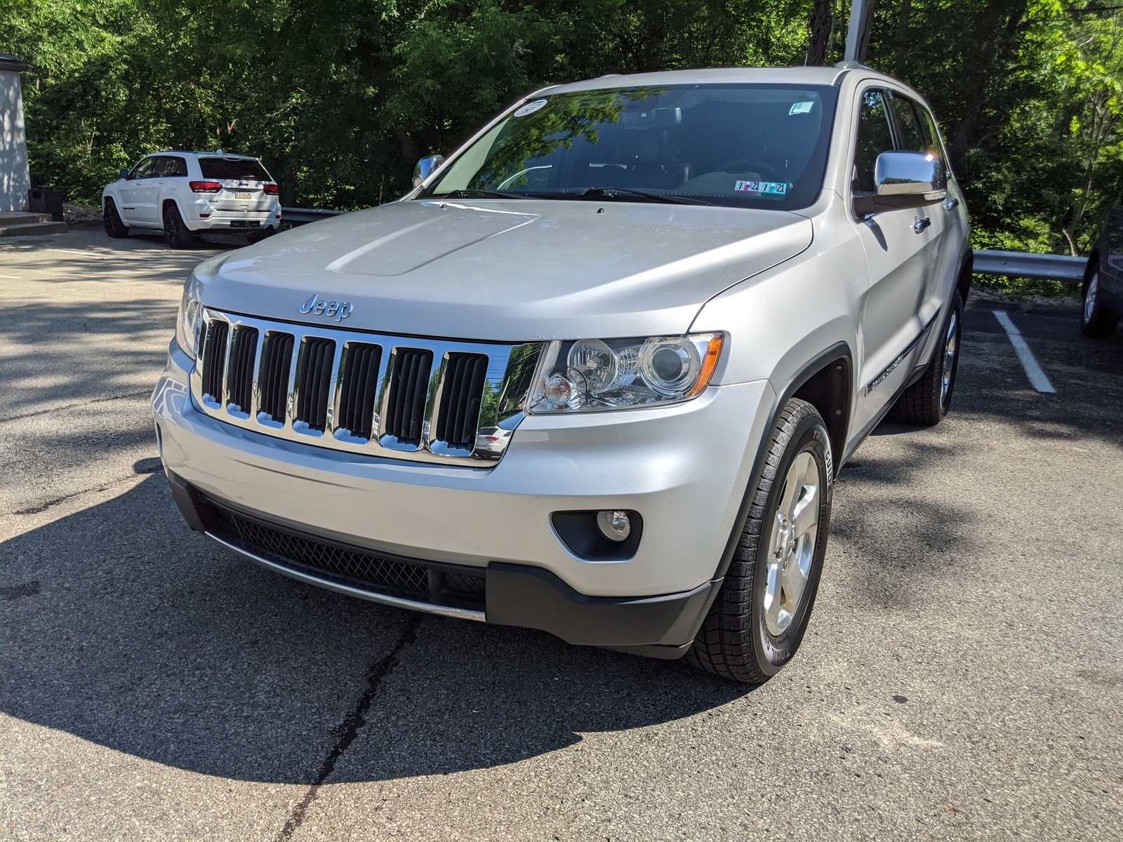 PreOwned 2012 Jeep Grand Cherokee Limited in Bright